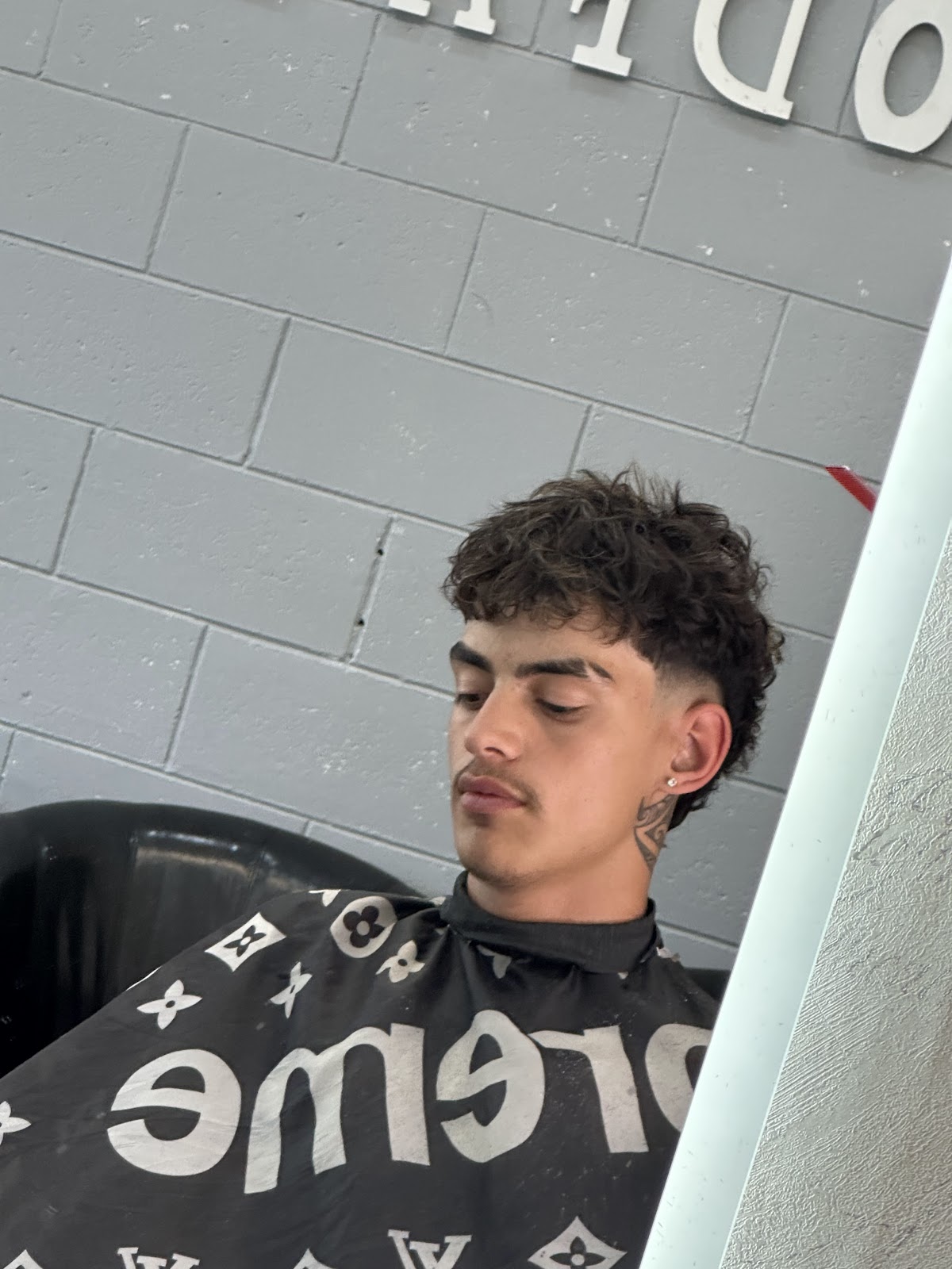 Burst fade mullet cut in the shop